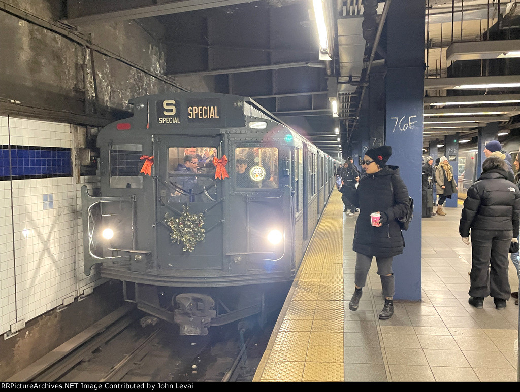 2nd Ave bound NYCTA Holiday Train paused at Broadway-Lafayette Station 